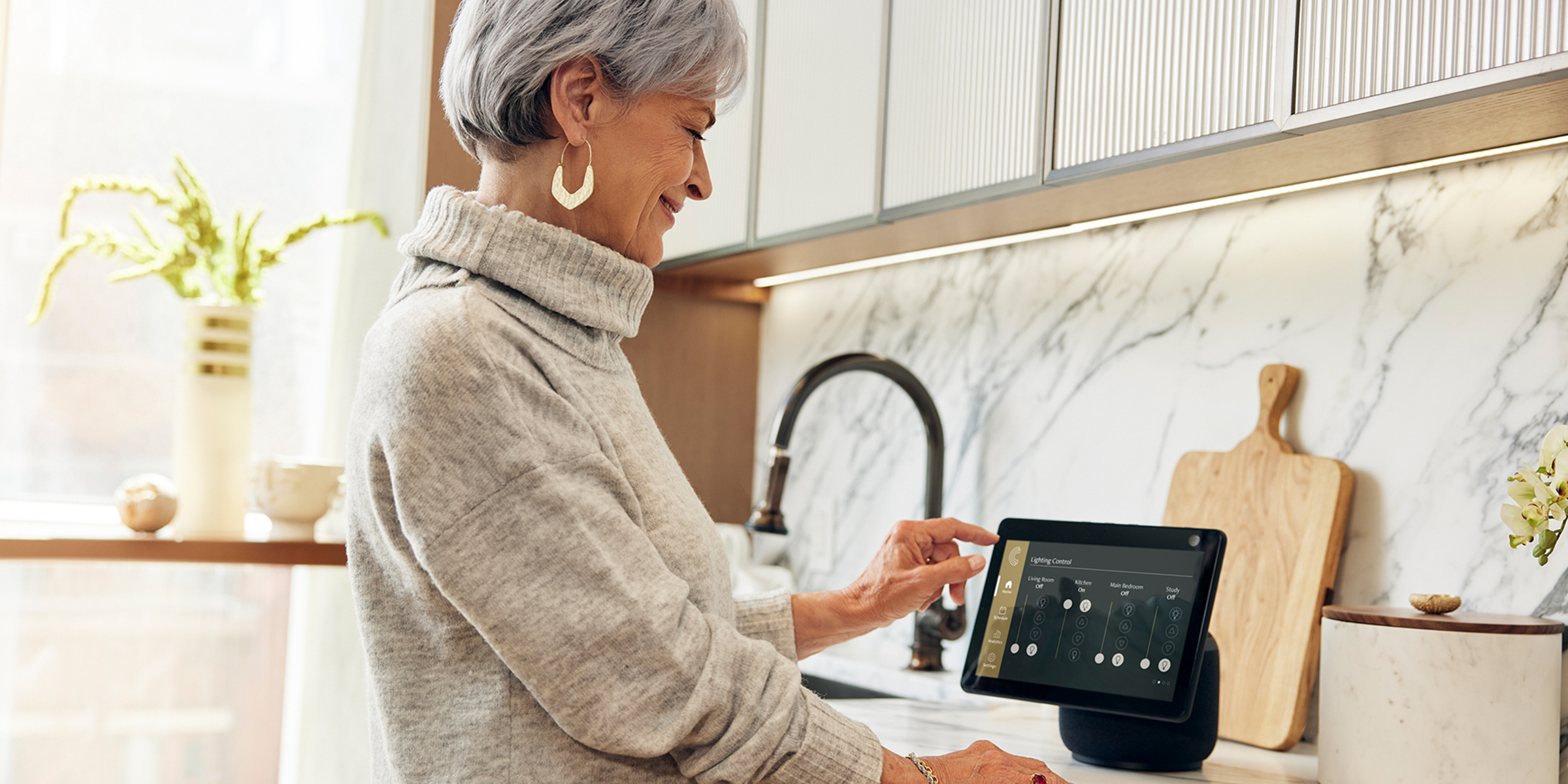 Coterie resident in their apartment using smart home technology