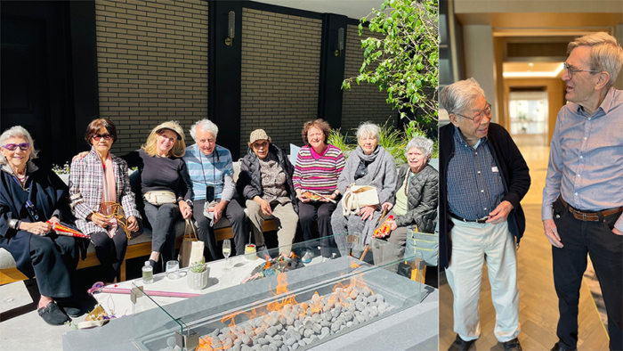 Coterie residents socializing by firepit outdoors