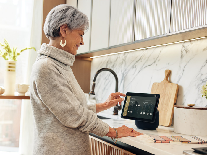 Coterie resident using Alexa in kitchen