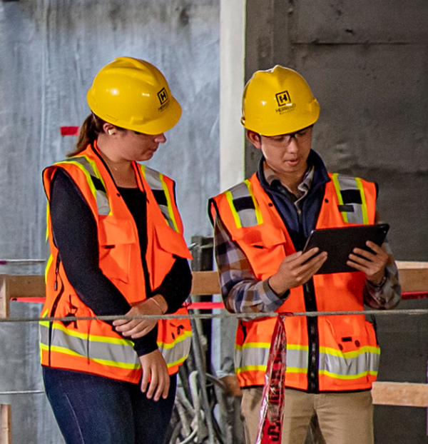 two construction workers in hard hats