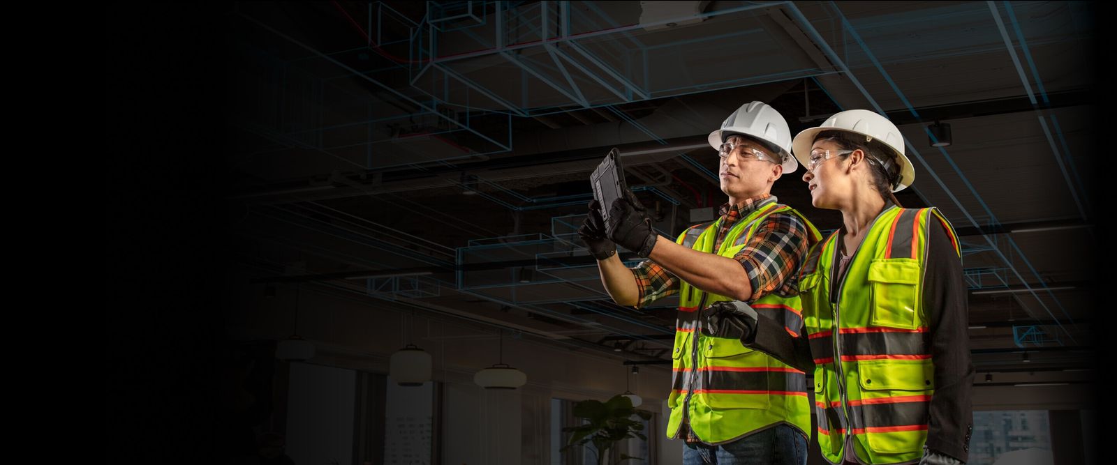 Autodesk Construction Cloud workers looking at tablet