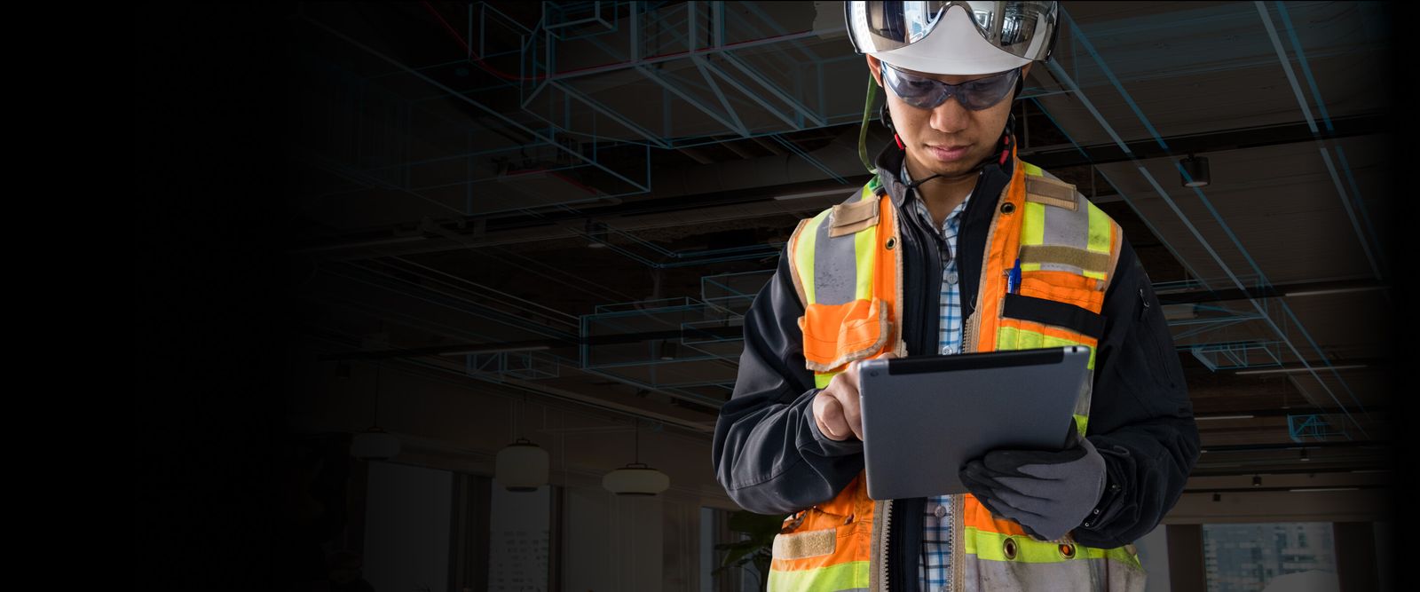 Construction worker holding tablet