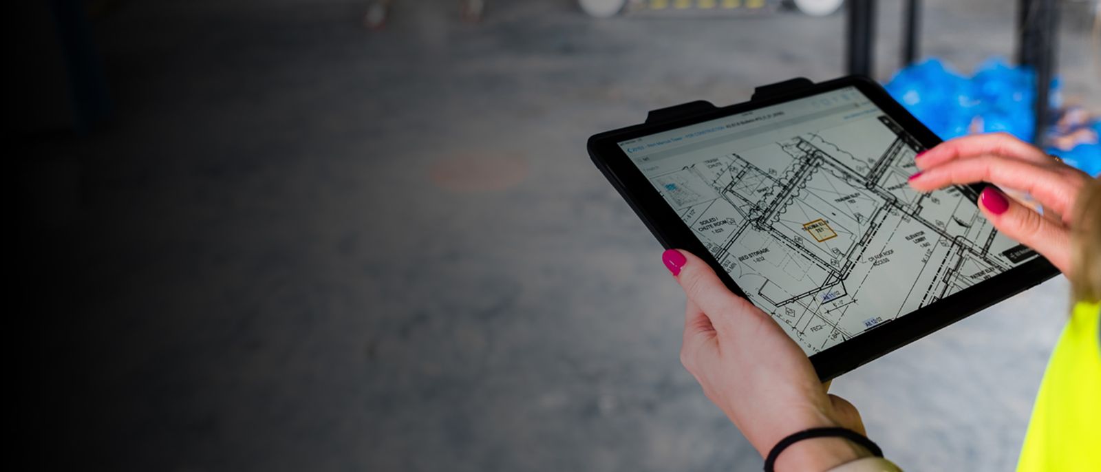 Construction workers using Plangrid app on an ipad tablet