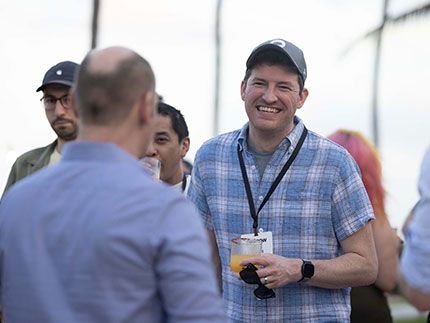 Enjoying laughs with colleagues at all-hands