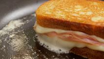 Chef Alex Chen preparing a Truffle Mortadella Grilled Cheese in a modern kitchen setting at Trail Appliances Richmond Showroom - Sub-Zero Wolf kitchen