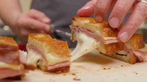 Chef Alex Chen preparing a Truffle Mortadella Grilled Cheese in a modern kitchen setting at Trail Appliances Richmond Showroom - Sub-Zero Wolf kitchen