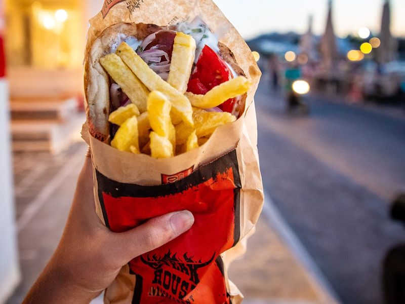 A hand holding a gyro