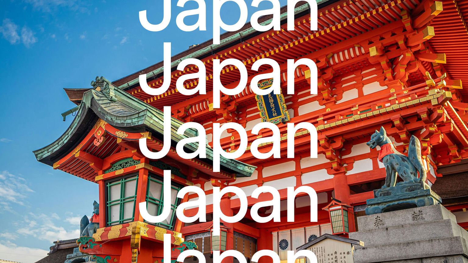 Traditional red and orange Japanese temple with ornate roof details and a statue, set against a clear blue sky. Large text overlay: "Japan".