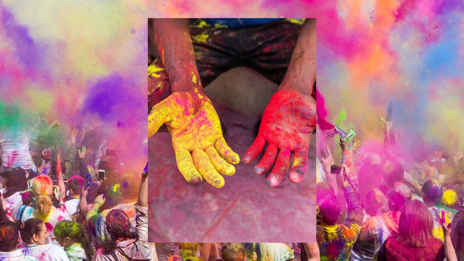 Painted hands and crowds throwing colorful powder in the air during Holi in India.
