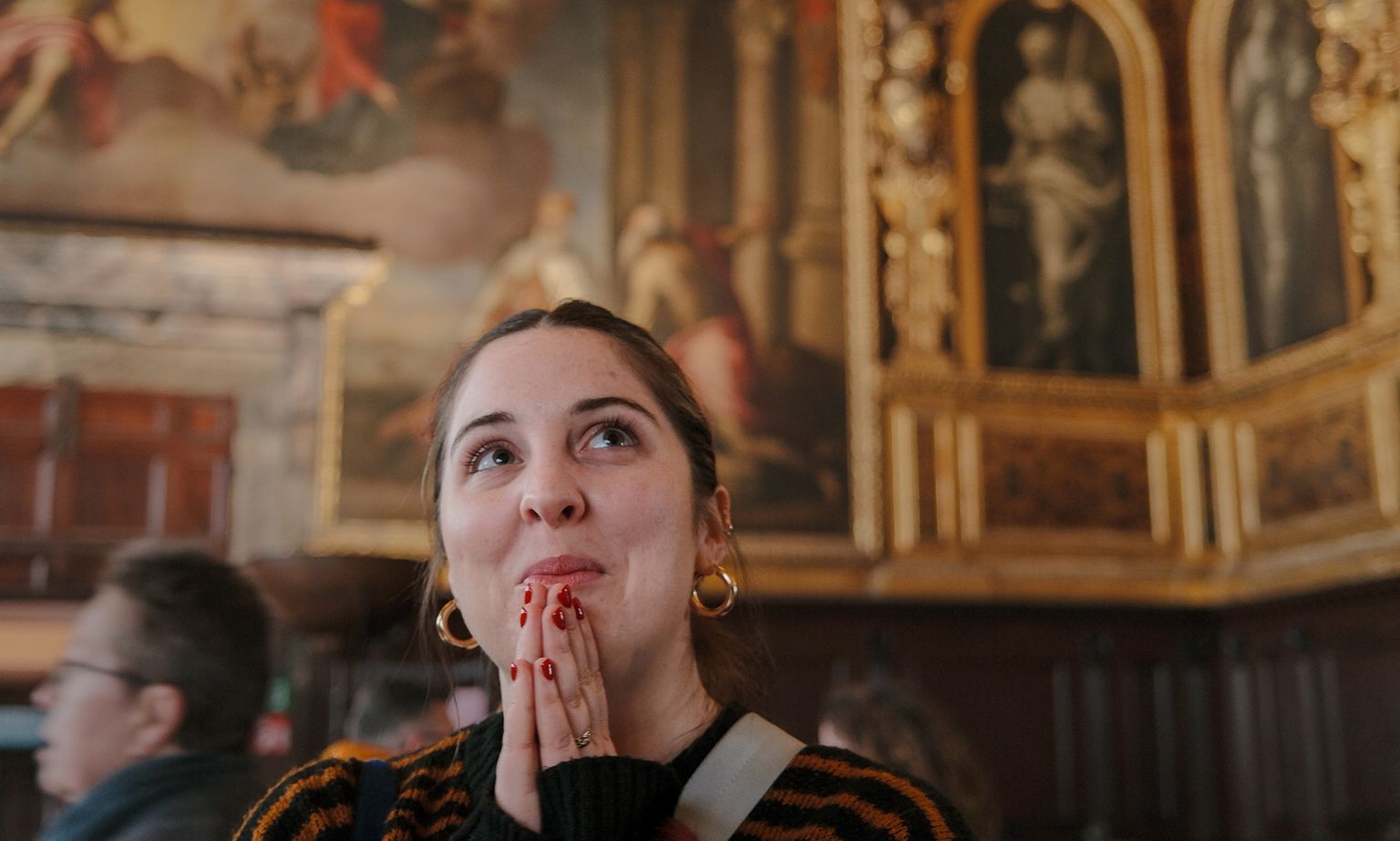 A person looking in awe at the art of a museum in Florence, Italy