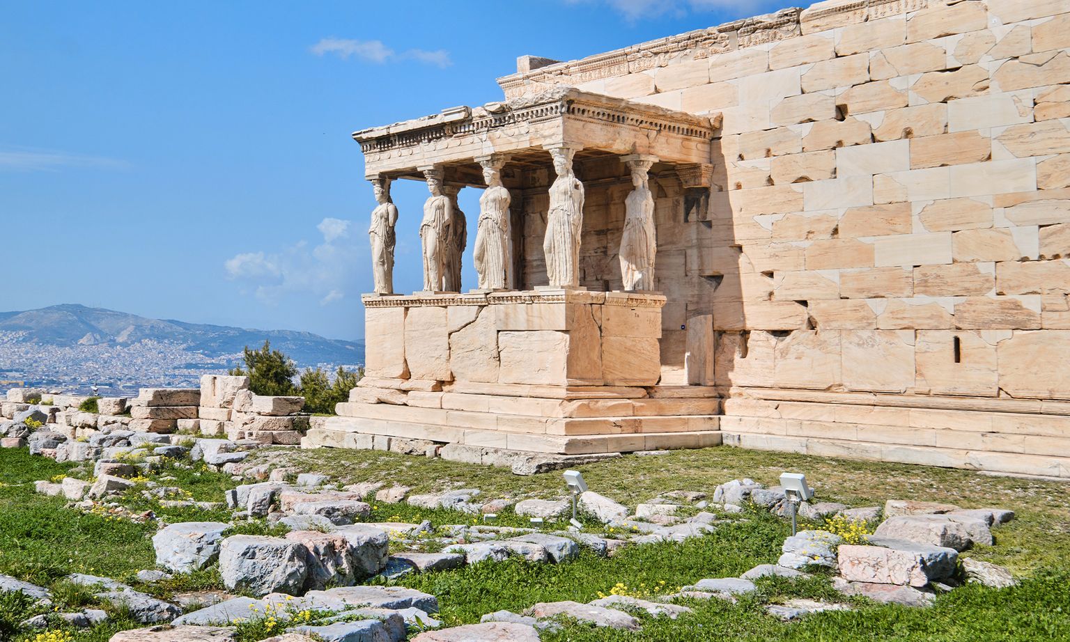 Ancient greek landmark with 5 women carved out of marble.