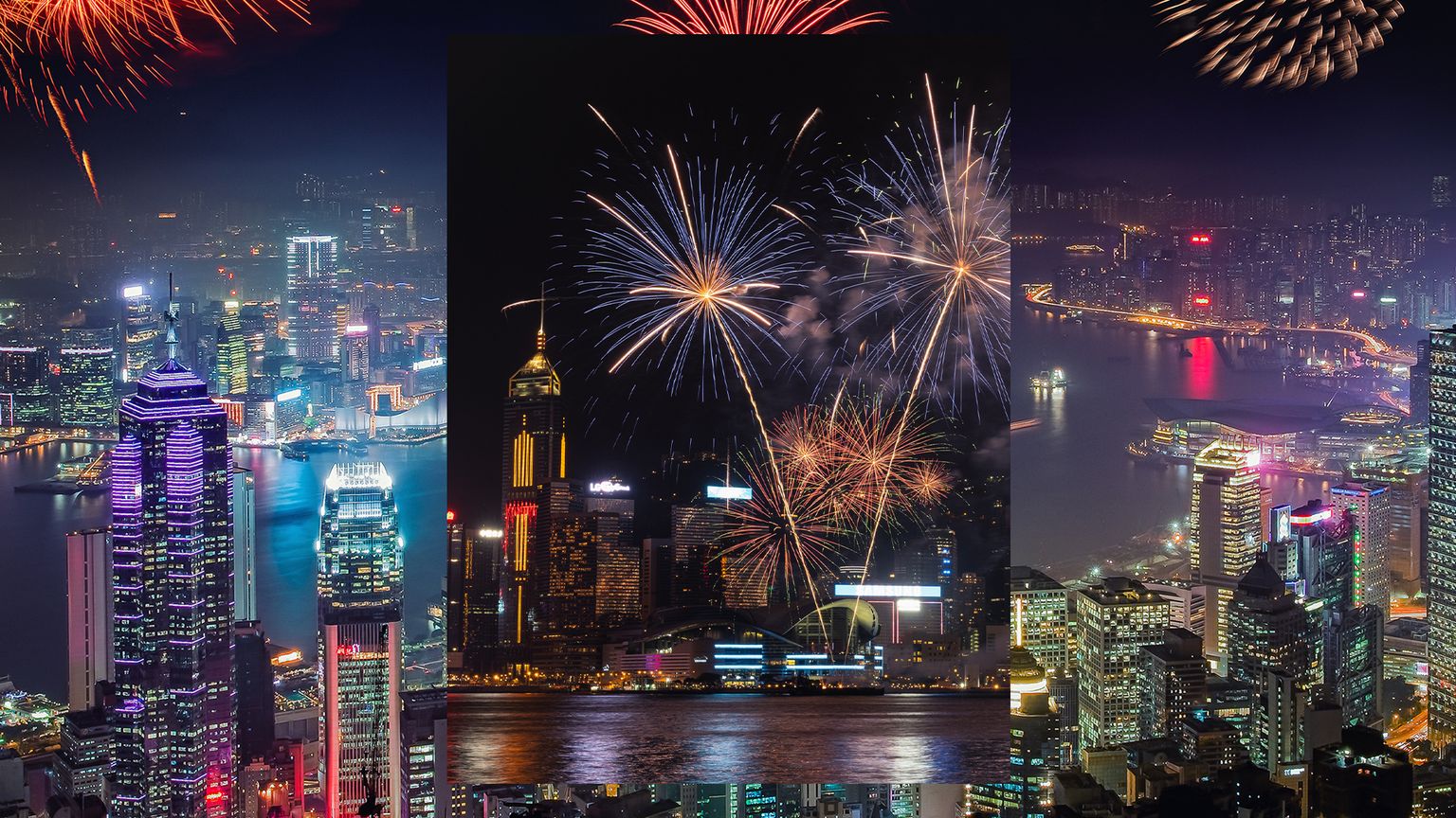 Fireworks exploding over the river and skyline of Hong Kong at night on New Year’s Eve
