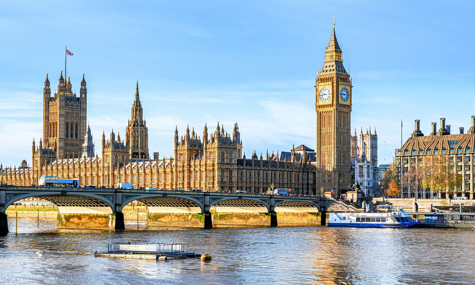 Views of the Palace of Westminster, Big Ben, and Westminster Bridge across the water in London, United Kingdom.