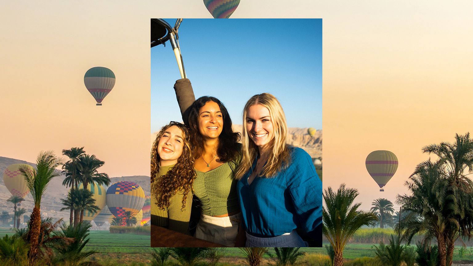 A photo of three people smiling in the basket of a hot air balloon over a phot of balloons floating over palm trees at sunrise