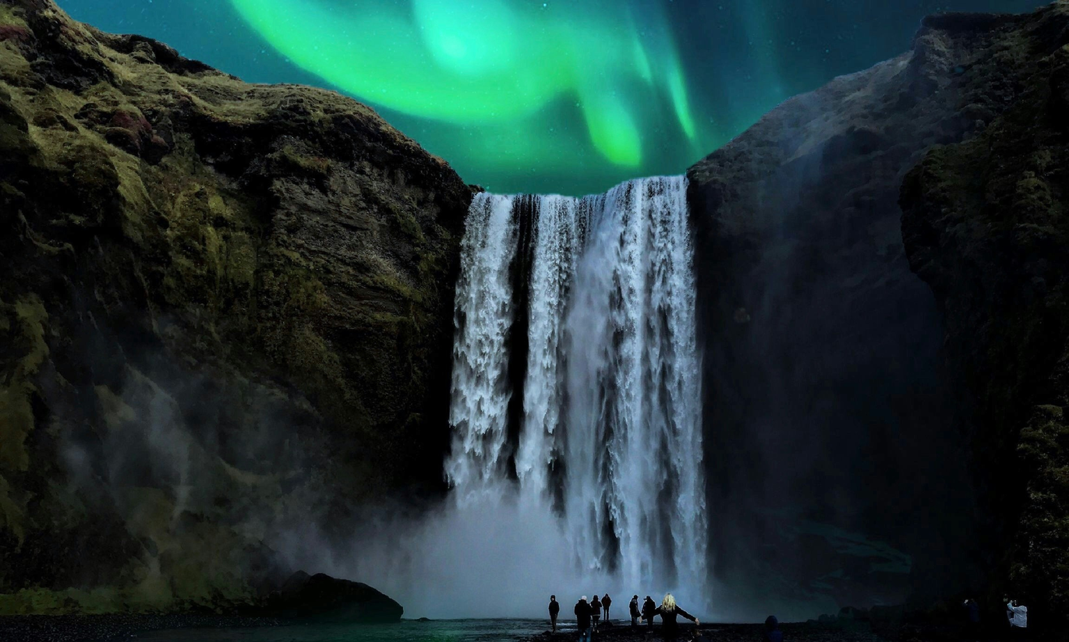 A group of people stand near a waterfall under a vibrant green aurora borealis in a rocky landscape at night.