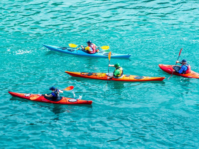 Kayaking in clear blue water