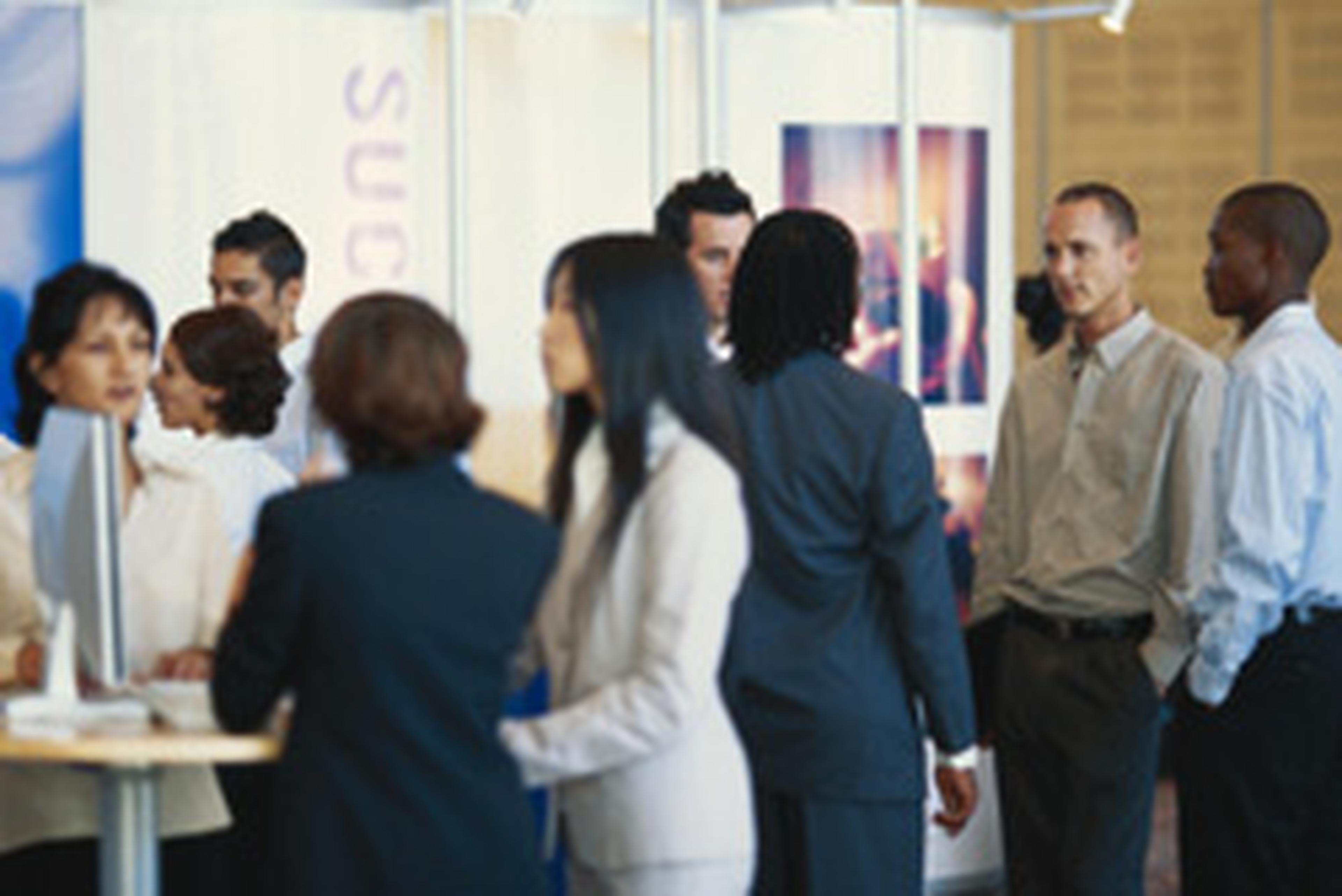 a group of business people mingling