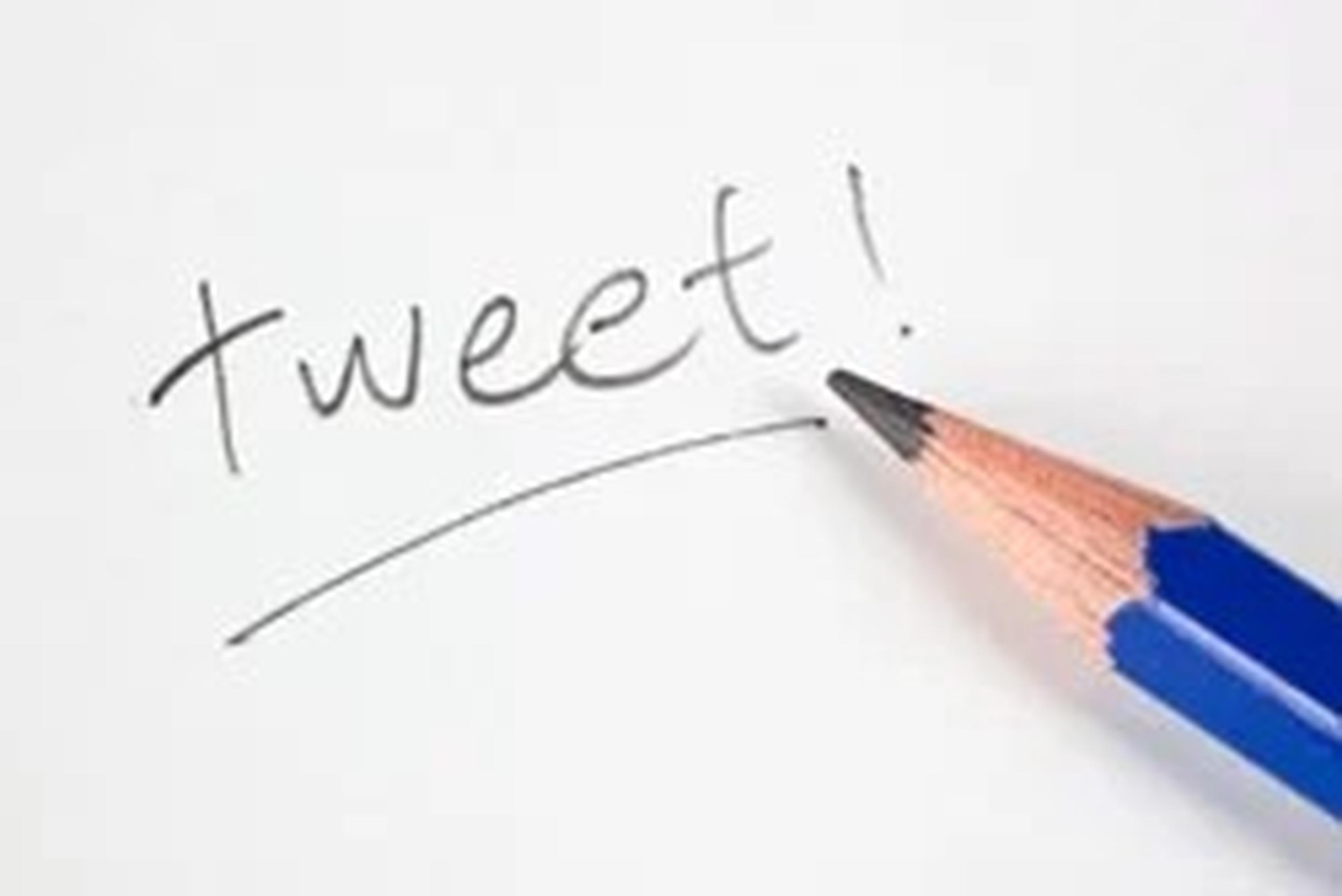 The word tweet! written in pencil with a pencil pointing towards it