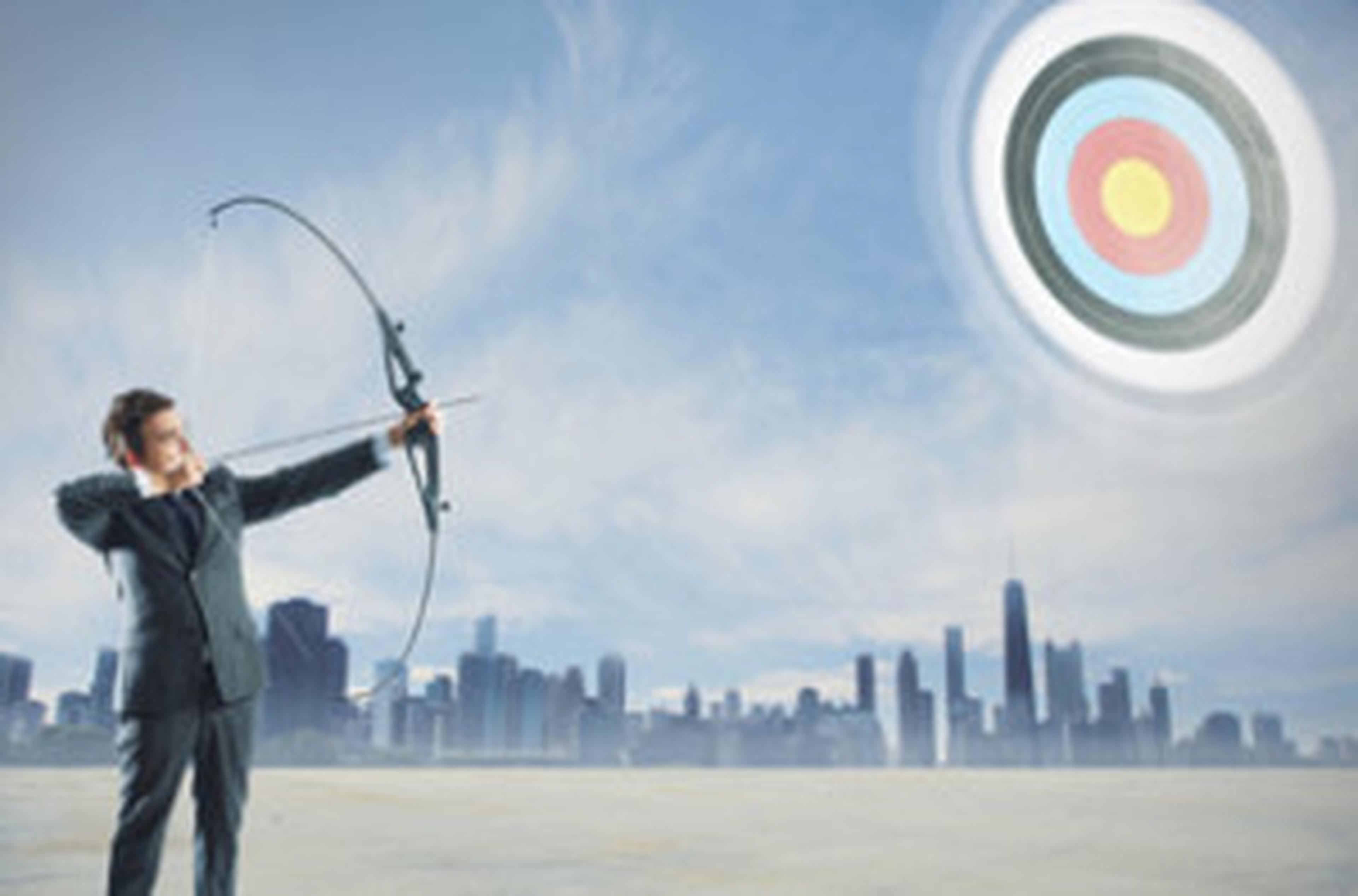 man with bow and arrow shooting at target in the sky