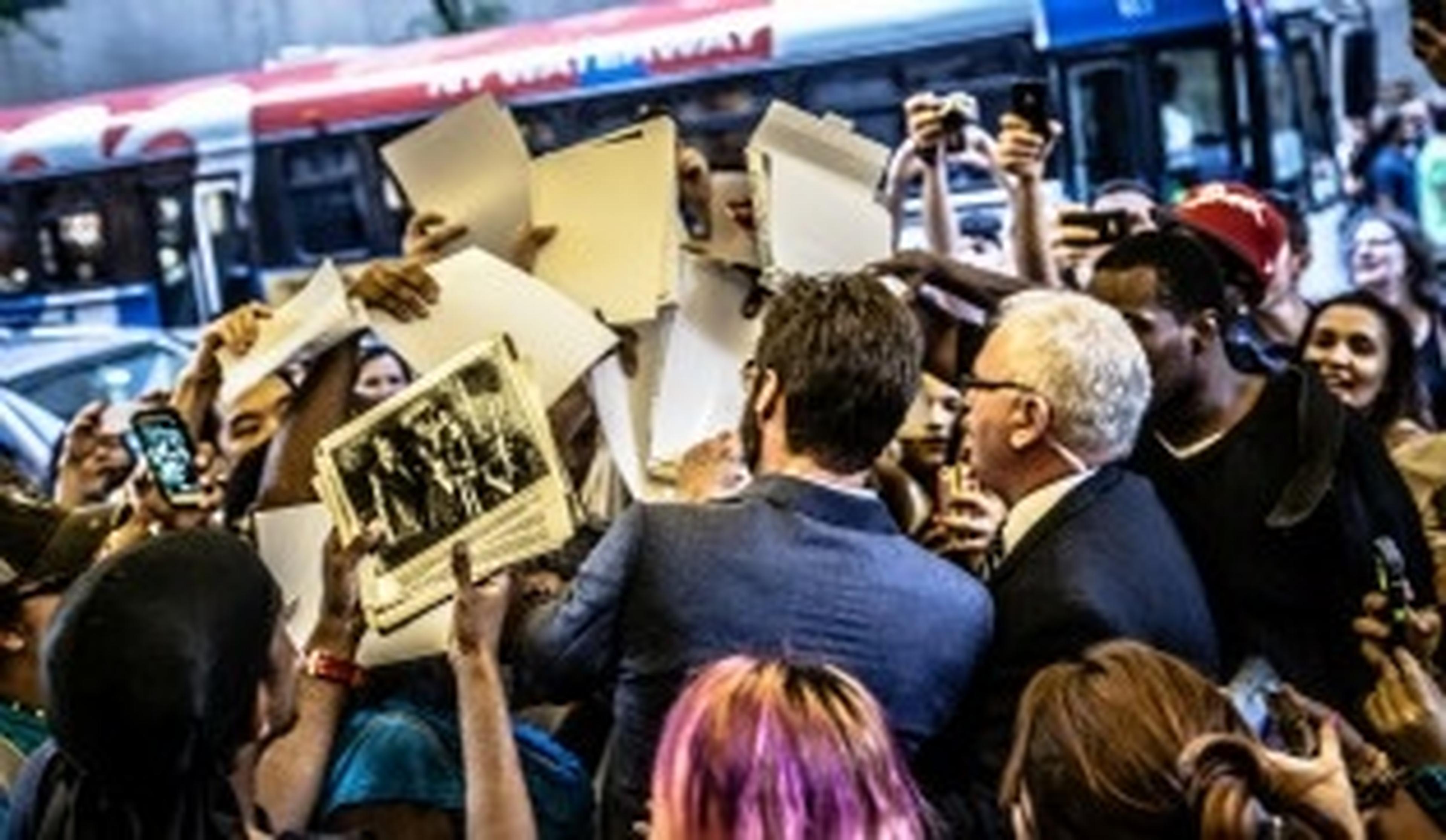 group of protestors with newspapers