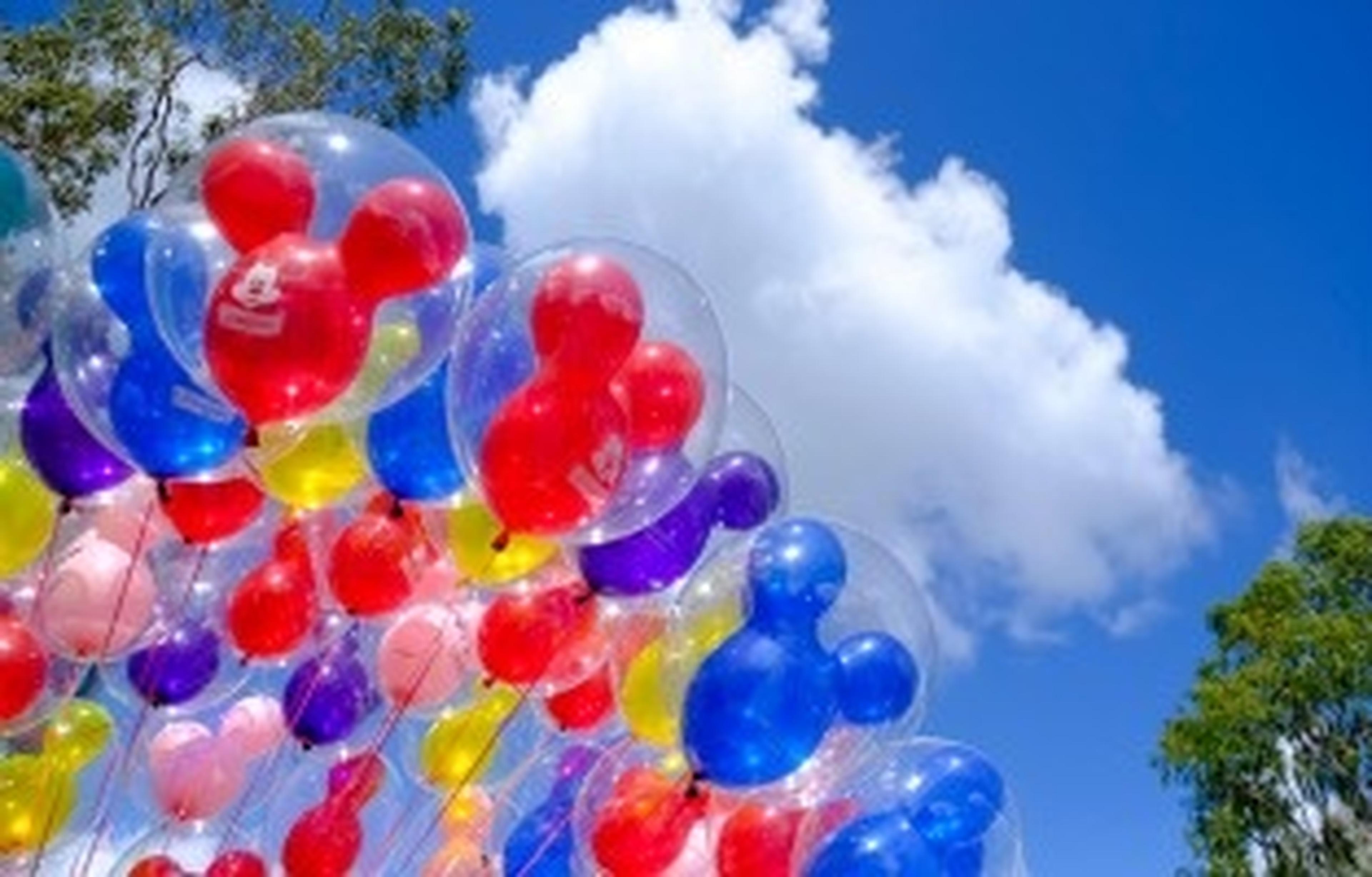 disney balloons with blue sky behind them