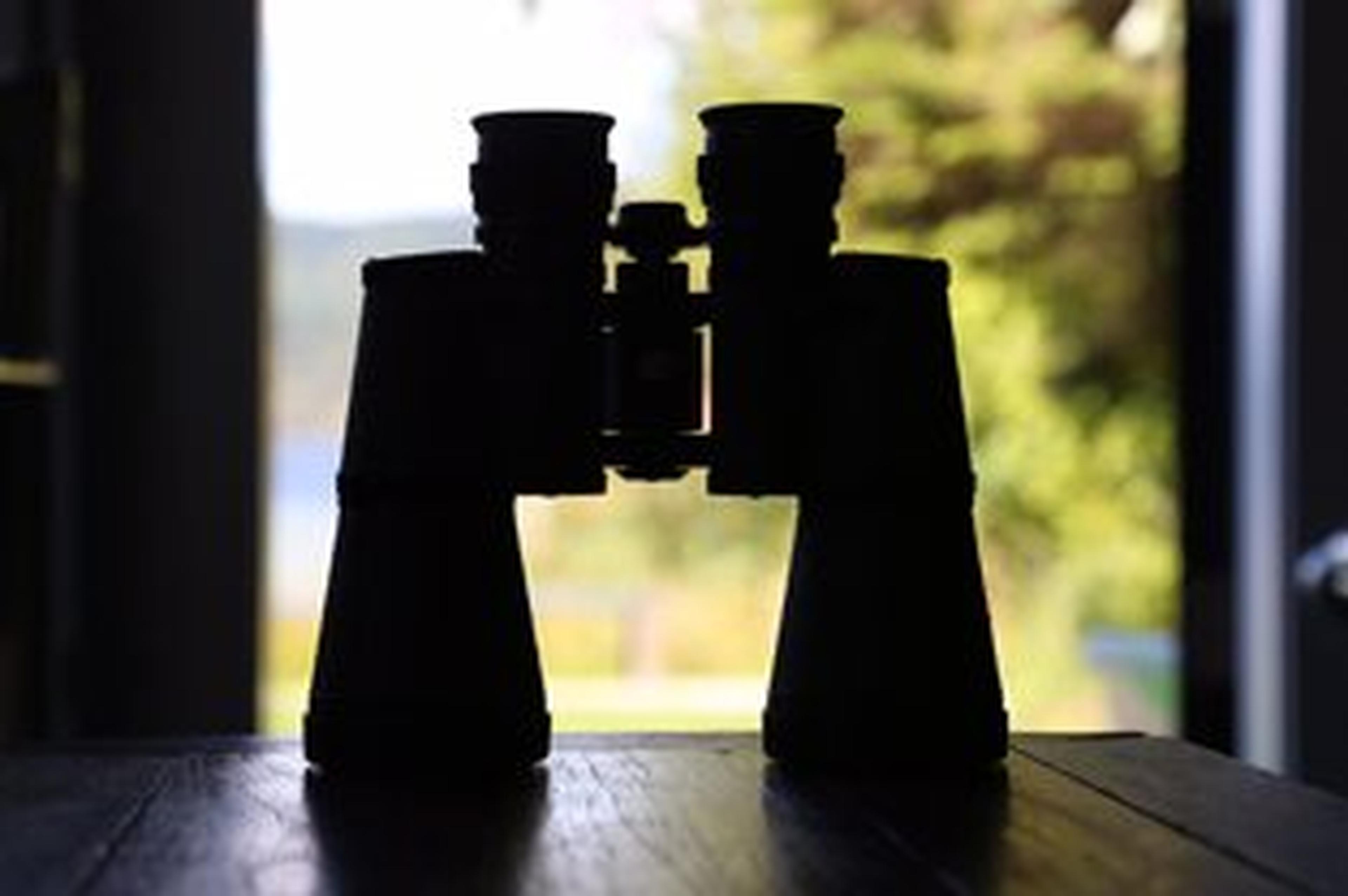 binoculars backlit on windowsill