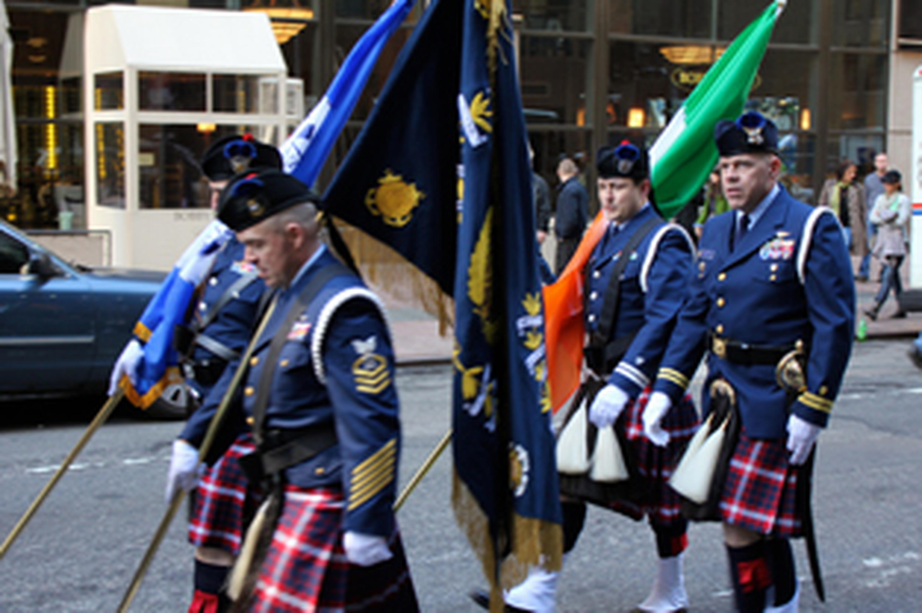 scottish men marching in a parade