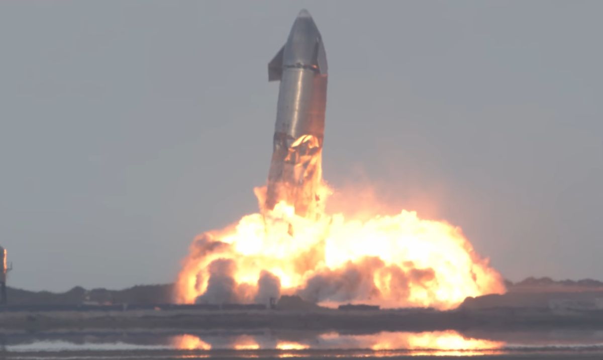 A crumpled Starship upper stage, flying off the ground due to an explosion in its base.