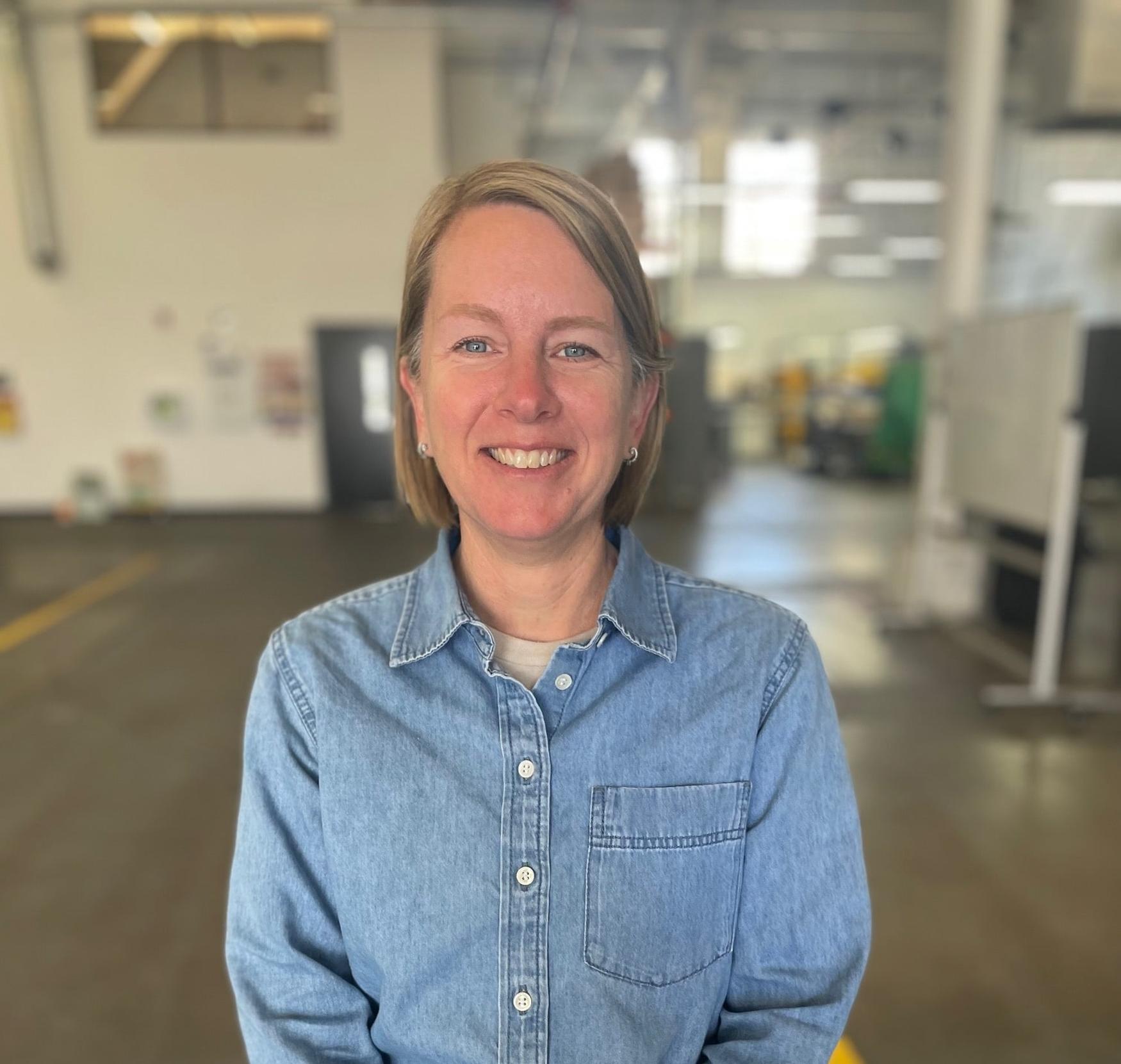 Jen, Carbon Removal Geologist at Charm Industrial, smiling in an office setting