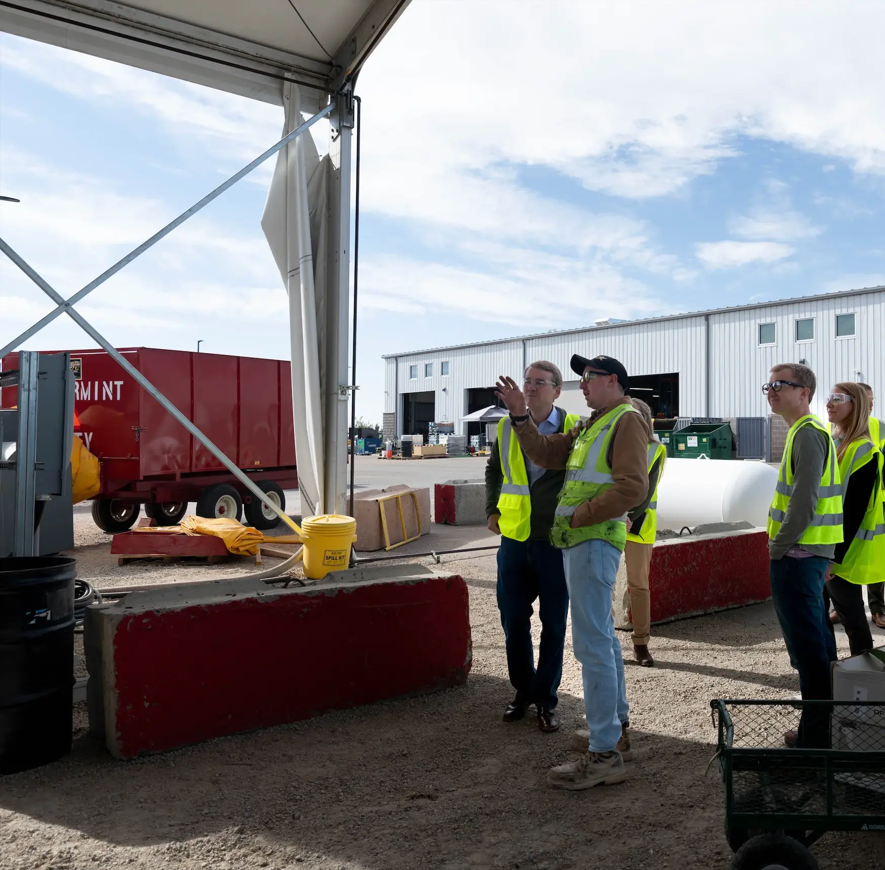 Joel Ramsey, Charm’s Pyrolysis Operations Supervisor show Senator Bennet how the pyrolysis process works.