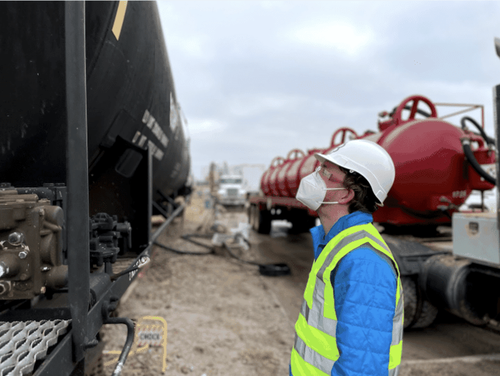 Charm Industrial team member wearing hard hat and high-visibility vest working with red carbon injection equipment, representing the Stripe carbon removal delivery project