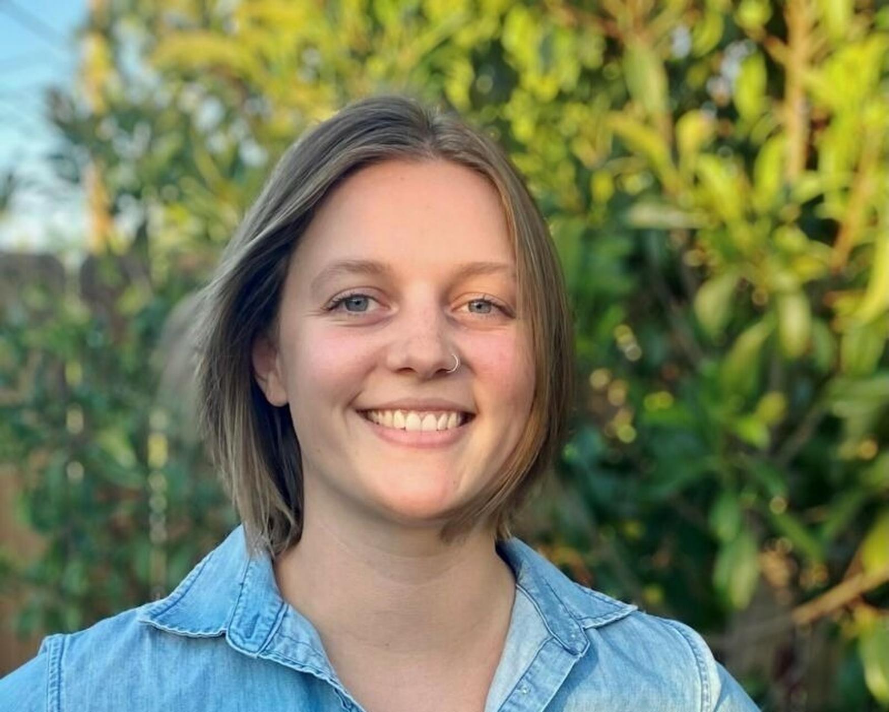 Katlyn Lonergan, Program Coordinator at National Forest Foundation, smiling outdoors