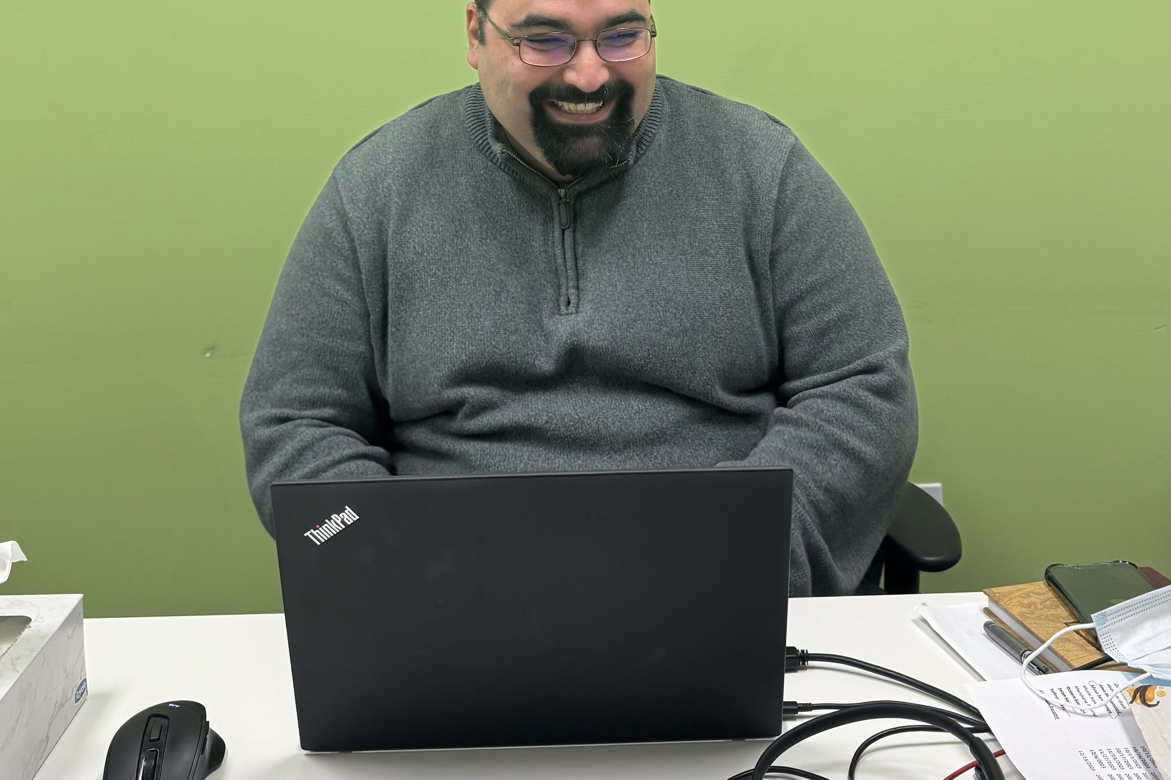 A man working on his laptop.