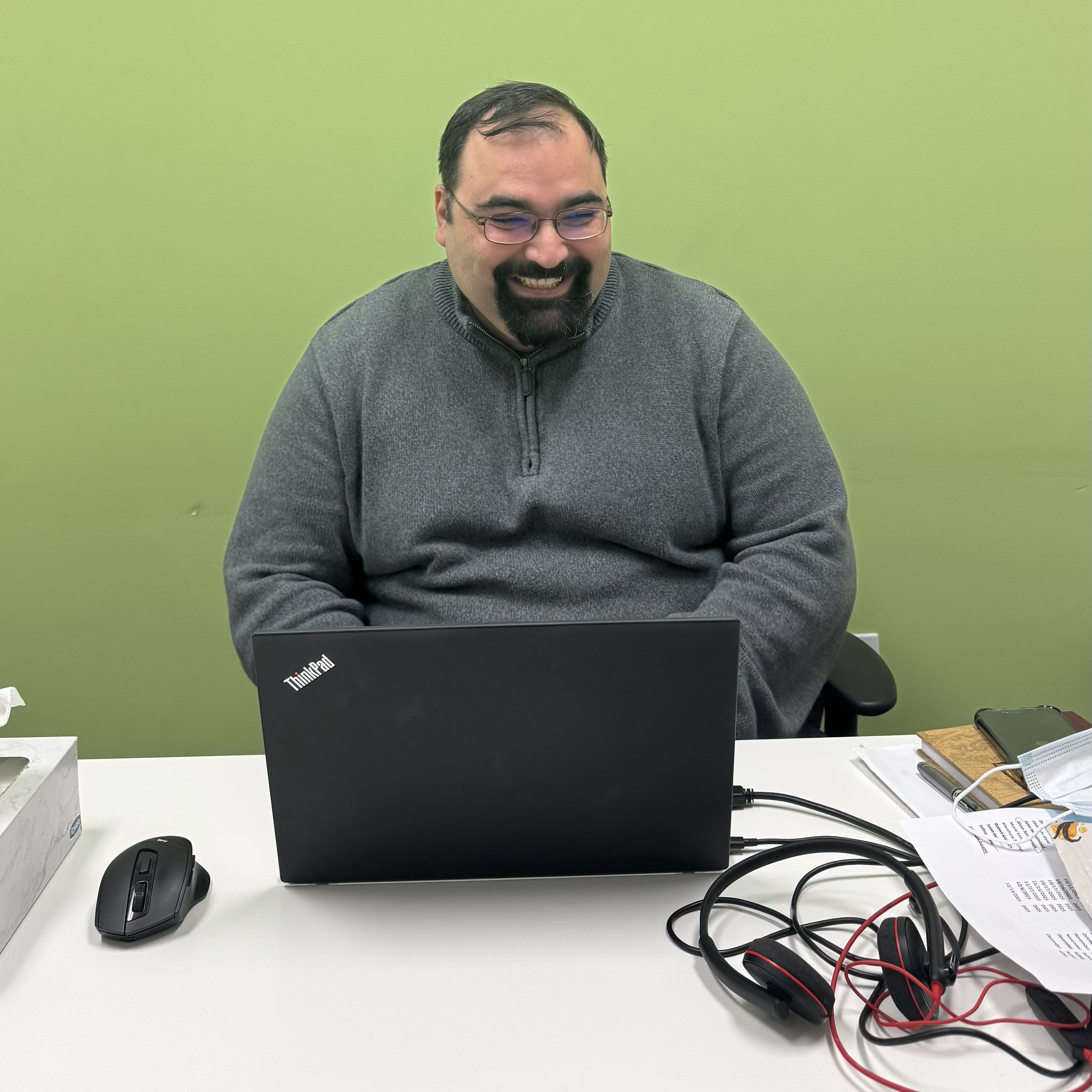 A man working on his laptop.