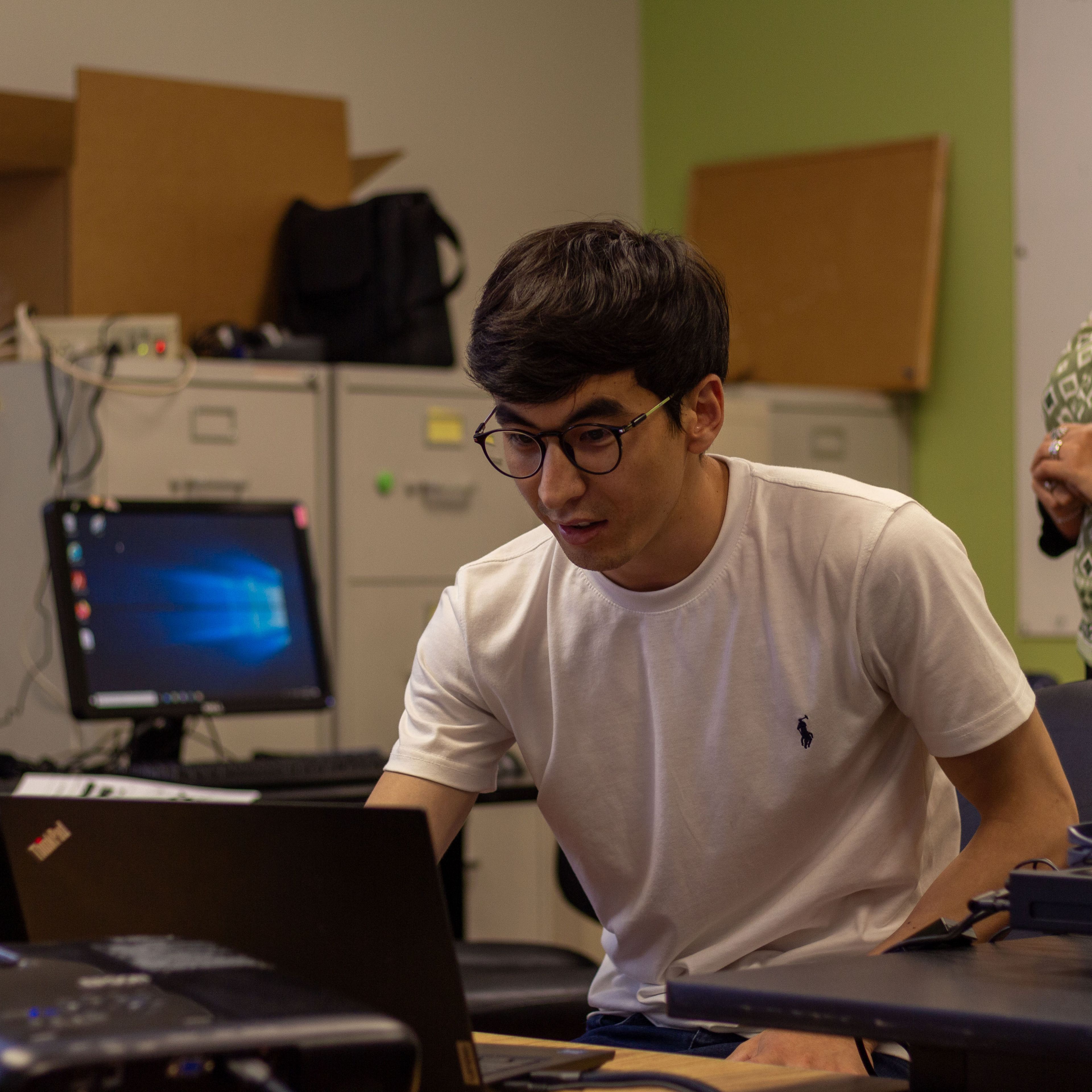 Participant of Computer Class working on a laptop