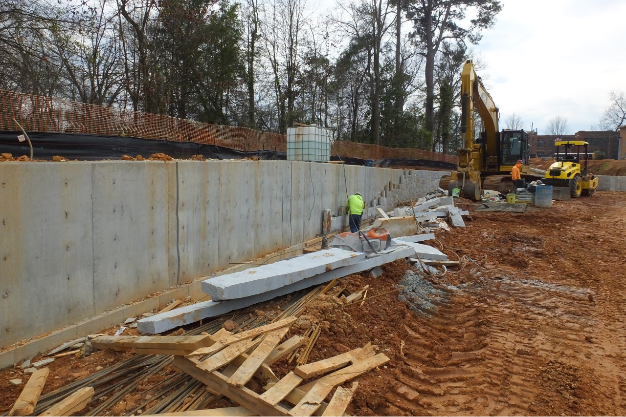 Retaining wall cladding with granite in progress. (Photo Credit: ABI Staff)