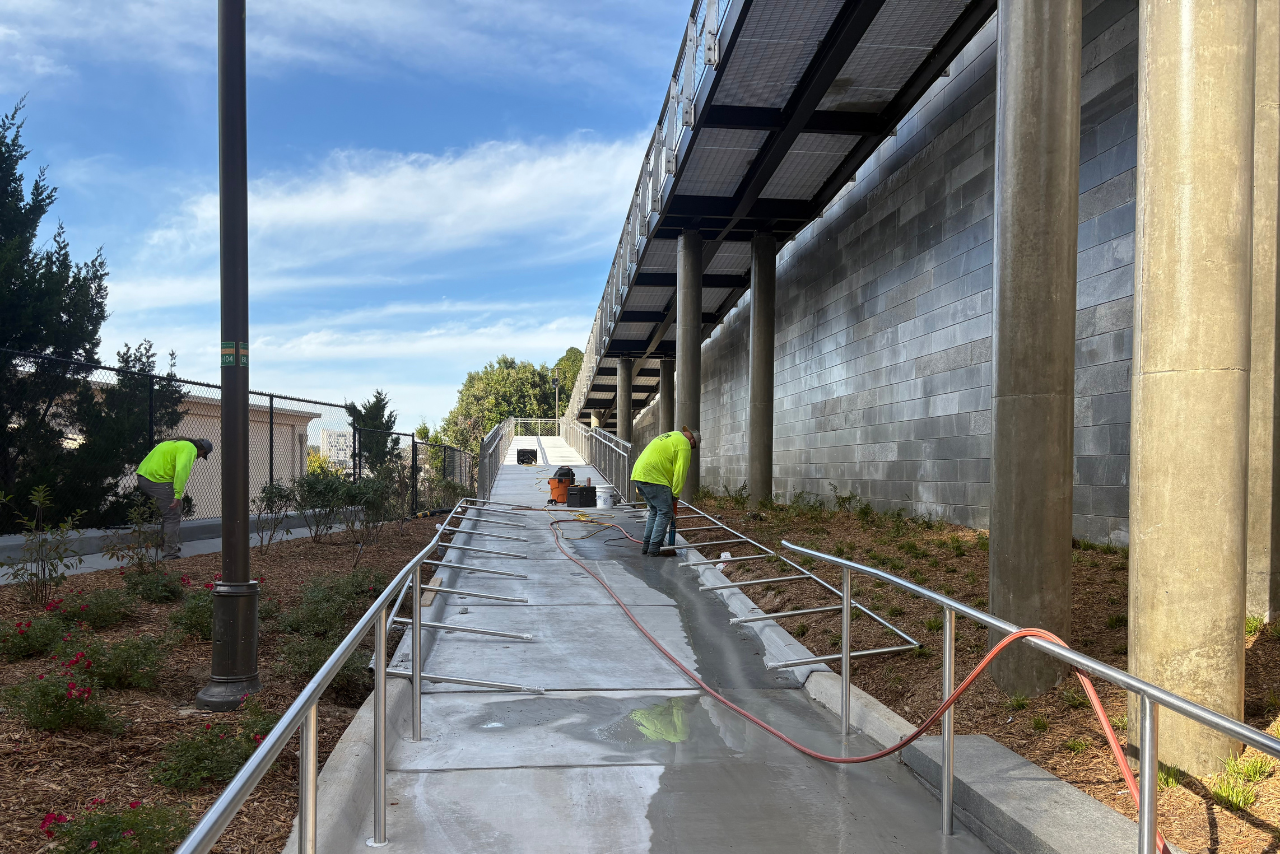 Final handrail installation at the lower level of the Ponce ramp. (Photo Credit: ABI Staff)