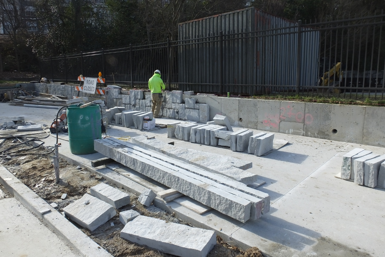 Granite cladding in progress on retaining walls at Peachtree Park Dr. NE. (Photo Credit: ABI Staff)