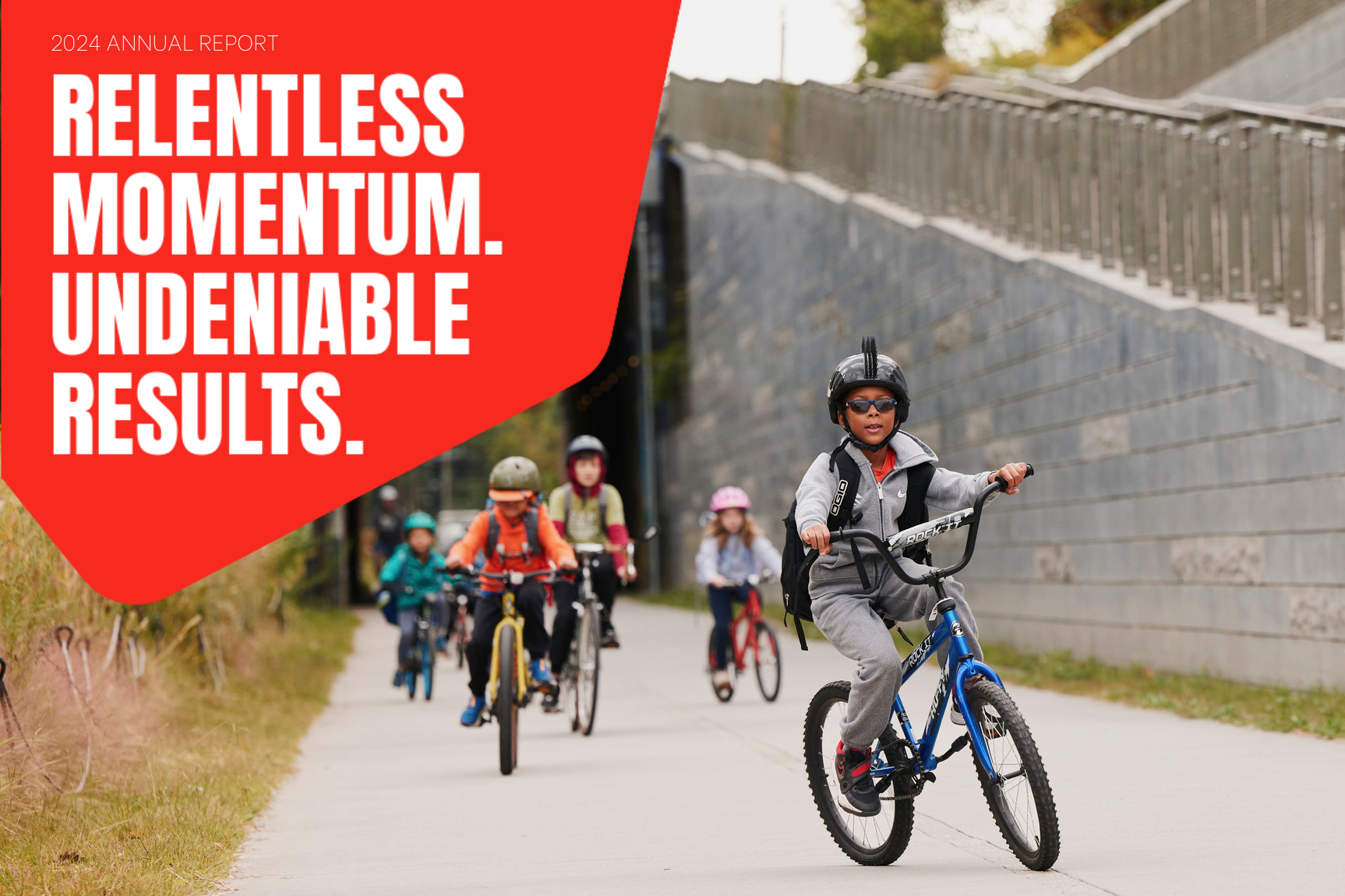 A photo shows a group of children biking on the Atlanta Beltline Southwest Trail. Above the photo is copy that reads, "2024 annual report. Relentless momentum. Undeniable results."