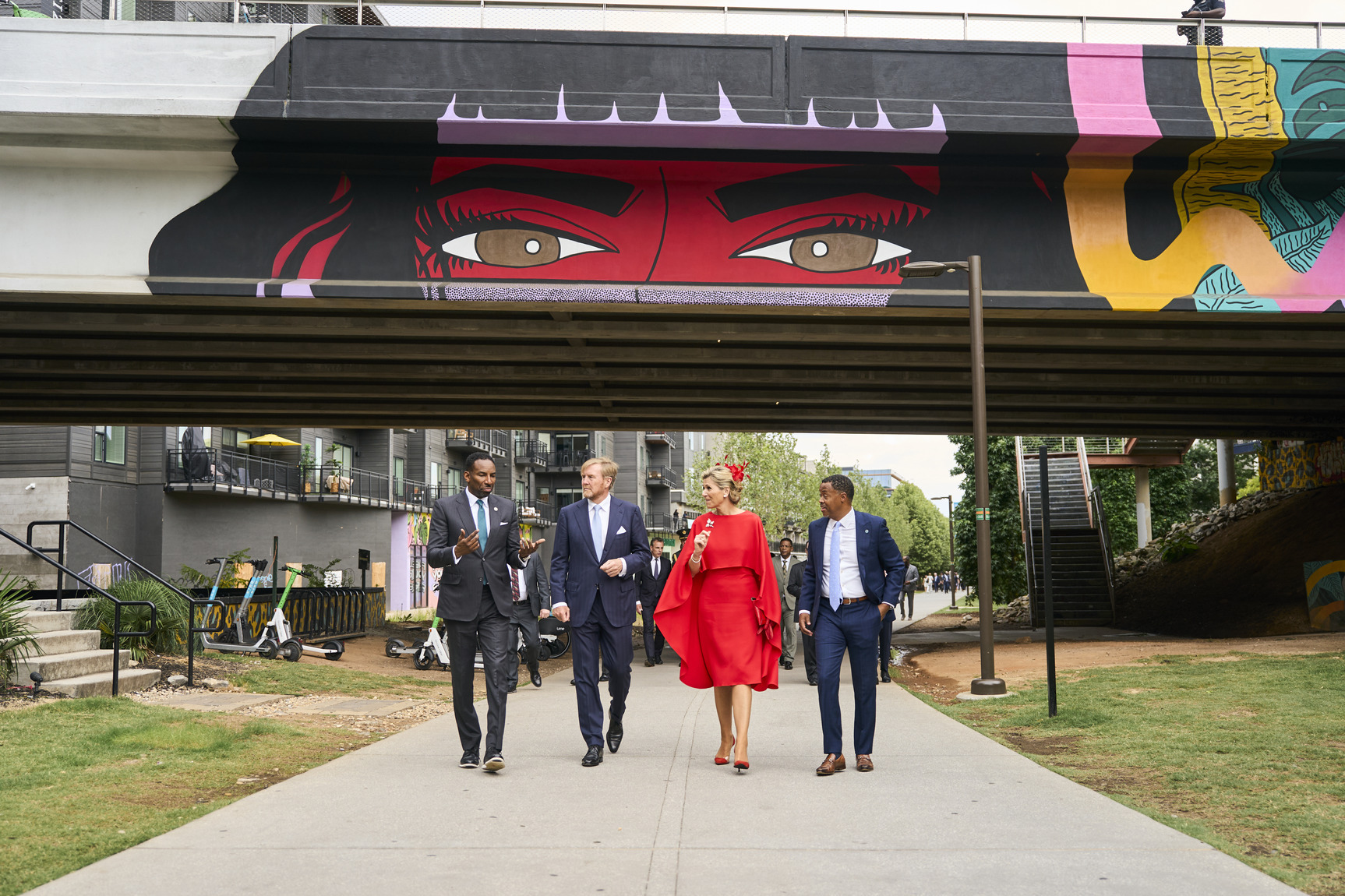 The mayor of Atlanta, the Dutch Royal Couple, and the President & CEO of Atlanta Beltline, Inc. walk together along the Eastside Trail.
