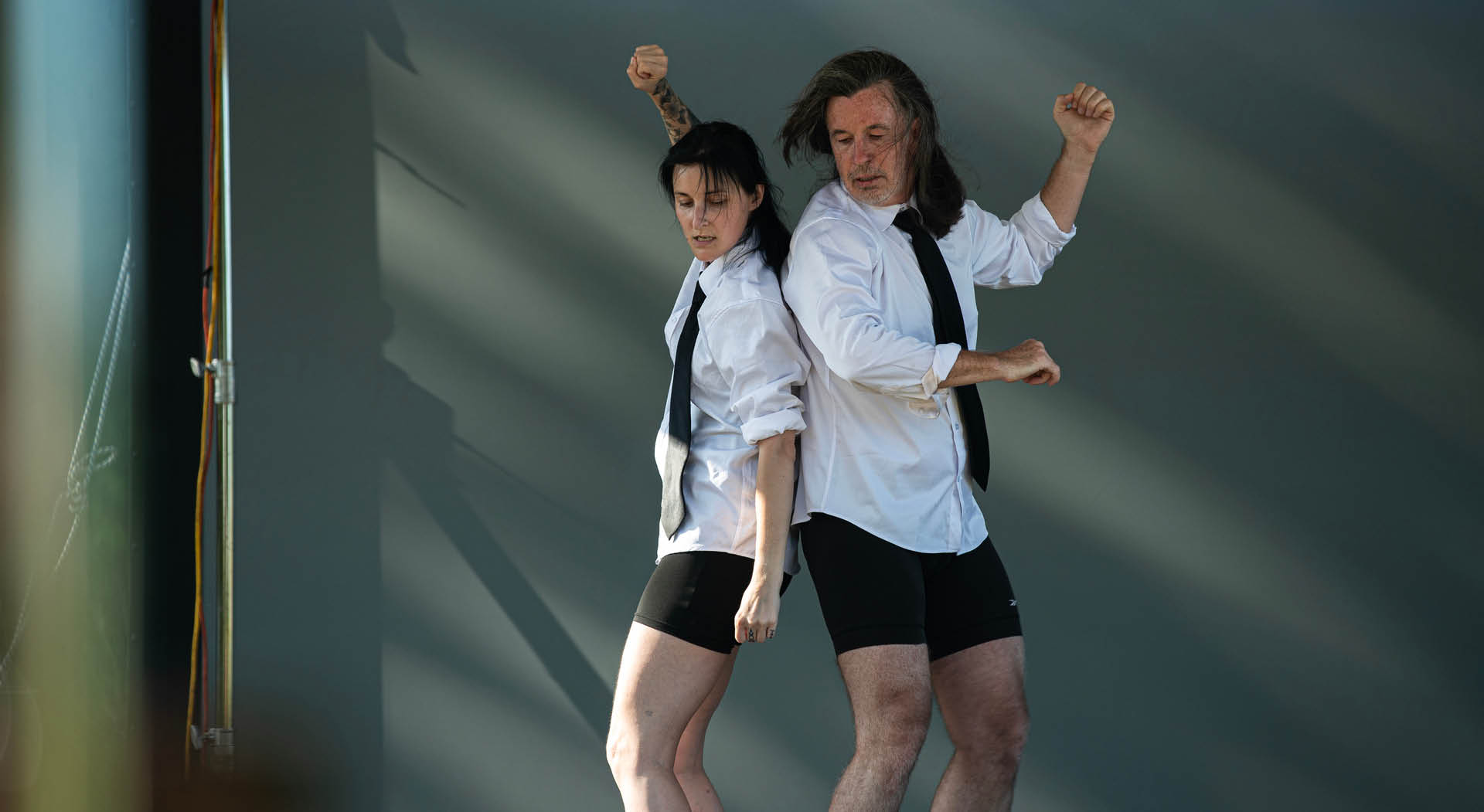 A woman and man act on stage as part of Burning Bones Physical Theater's performance during Beltline After Dark. (Photo Credit: Dr. Arshley Emile)