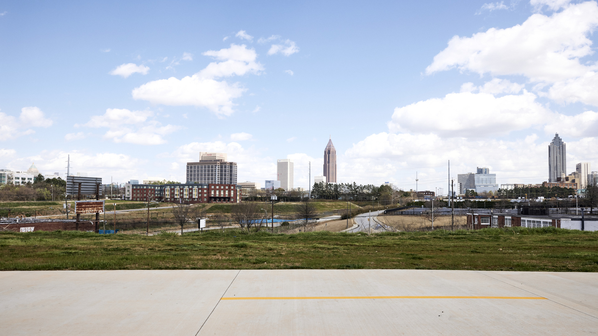 A pathway runs alongside a scenic view of downtown's skyscrapers.
