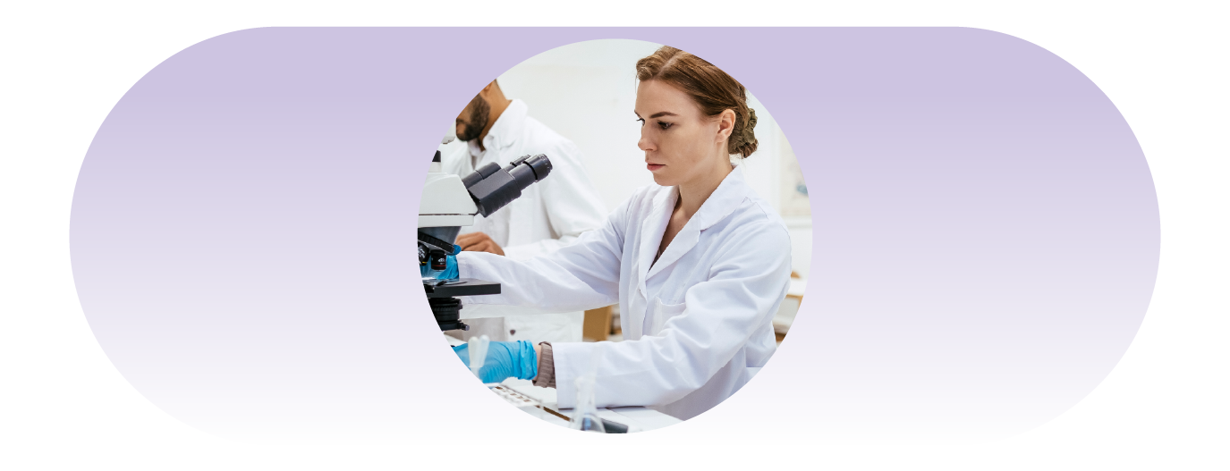 lab technician using microscope in the lab