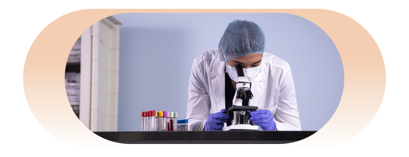 lab professional using microscope