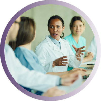 clinical leader talking to other clinicians
