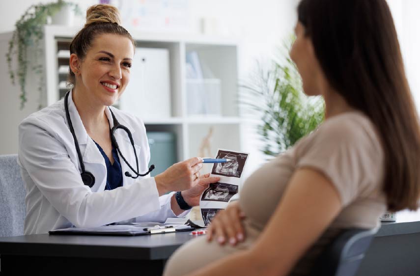 OB-GYN with a patient