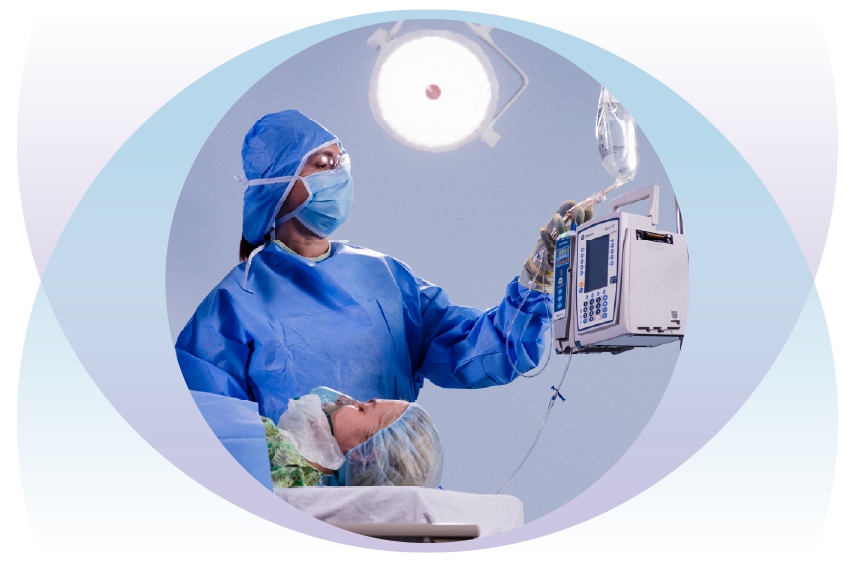 CRNA in OR with anesthetized patient.