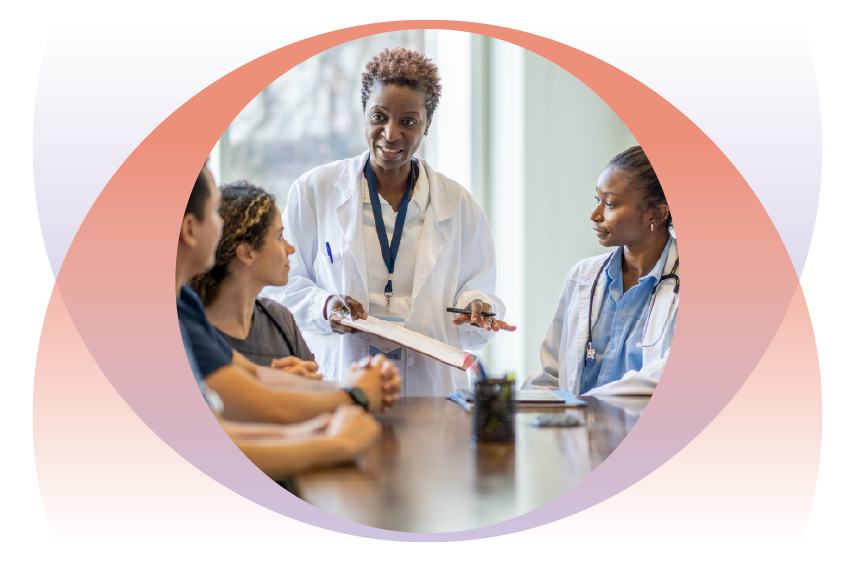 clinical leader meeting with a team of doctors and nurses