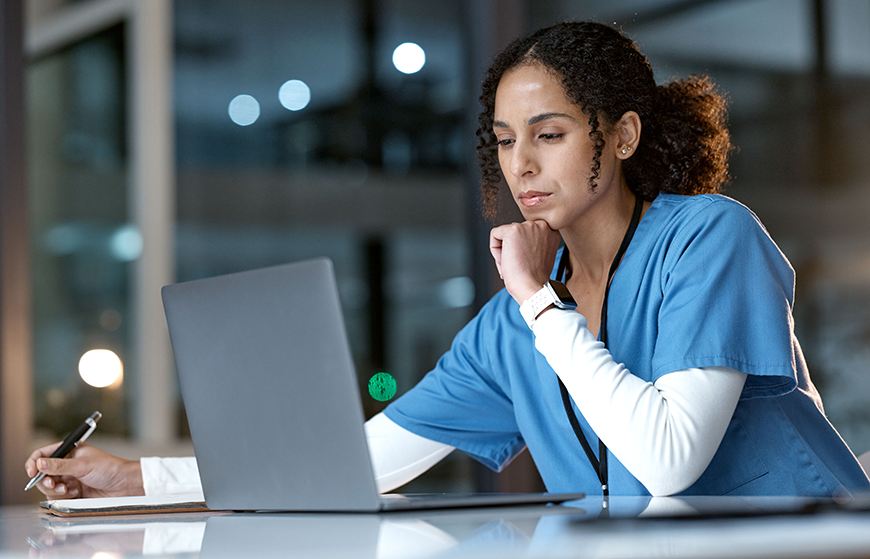 picture of a nurse practitioner at a computer