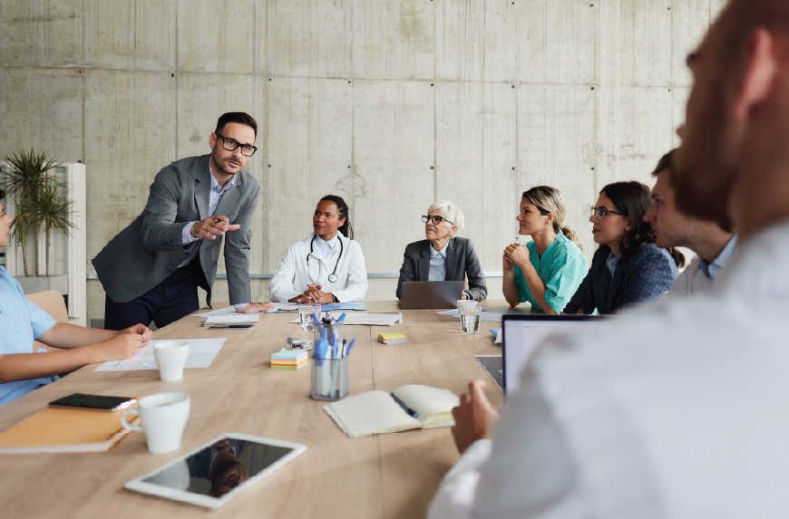 group of HCO executives in the board room